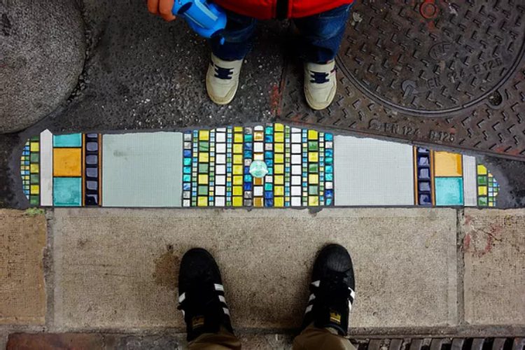 Artist Fixes Cracked Sidewalks and Potholes With Mosaics